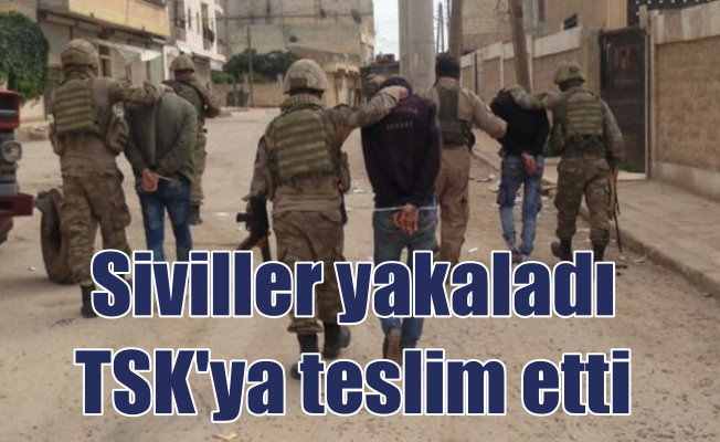 Afrin'de sivillerin yakaladığı teröristler TSK'ya teslim edildi
