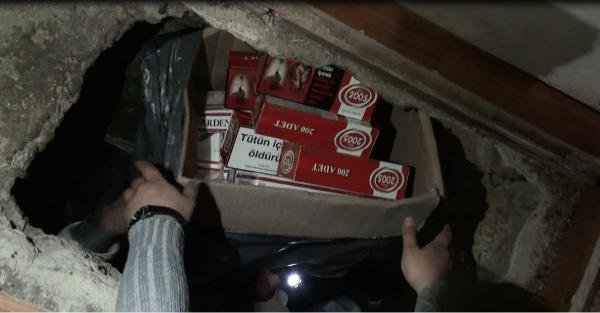 Elbise dolabının altına gizli odada 2 bin 159 paket kaçak buludu