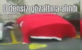 Türk bayrağıyla arabasını korumaya kalkan densiz gözaltına alındı