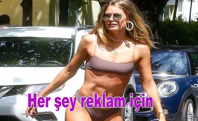 Bikinisi ile sokaklarda kaykay yaptı